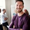 laughing-young-designer-standing-in-an-office-afte-2024-09-14-20-03-28-utc.jpg